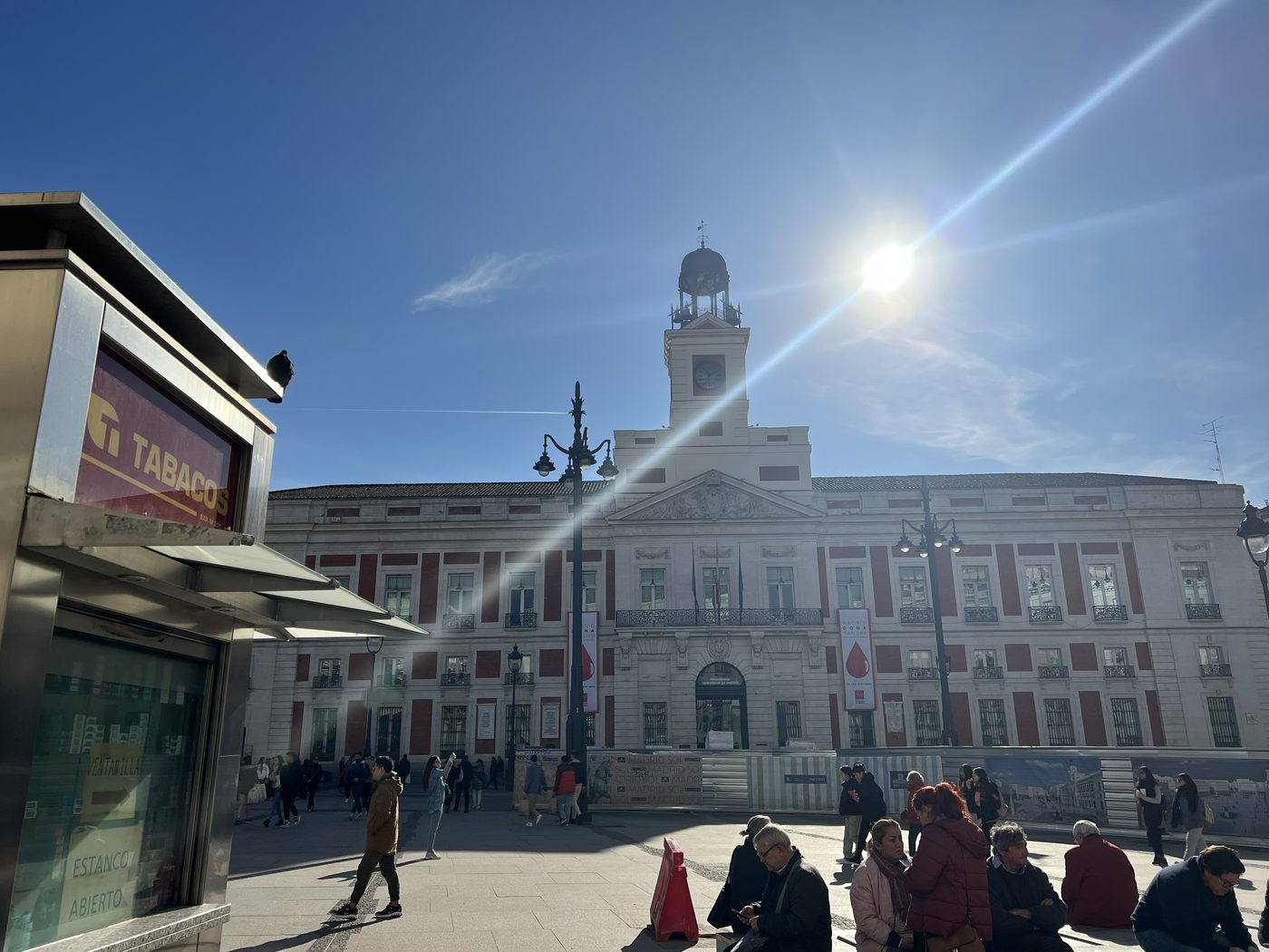 Pedestrians crossing Puerta del Sol in central Madrid